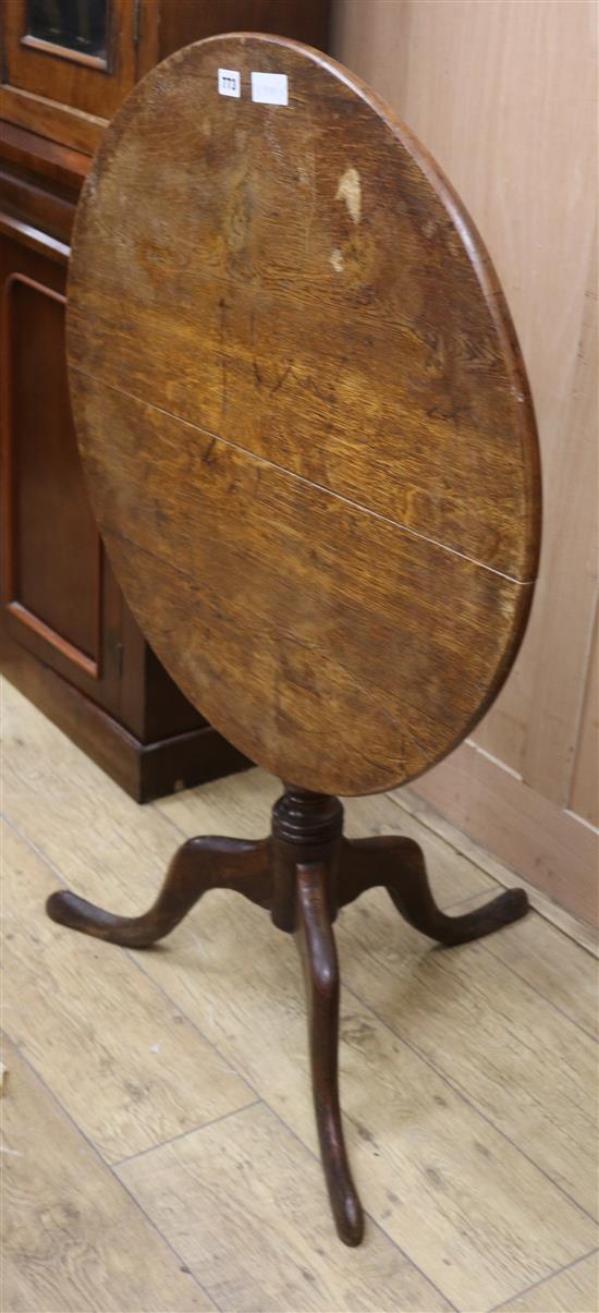 A George III oak tilt top tea table W.74cm